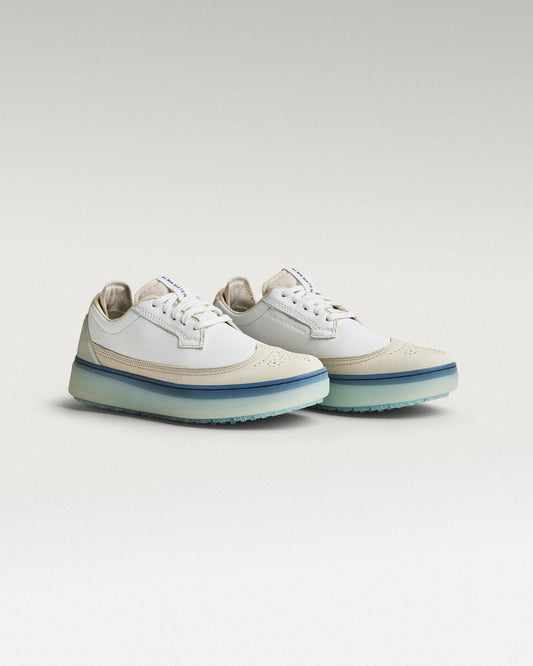 45 degree angled view of white/Navy Beta Longwing golf shoe