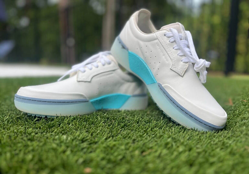 White/Aqua Beta Derby golf shoes on grass