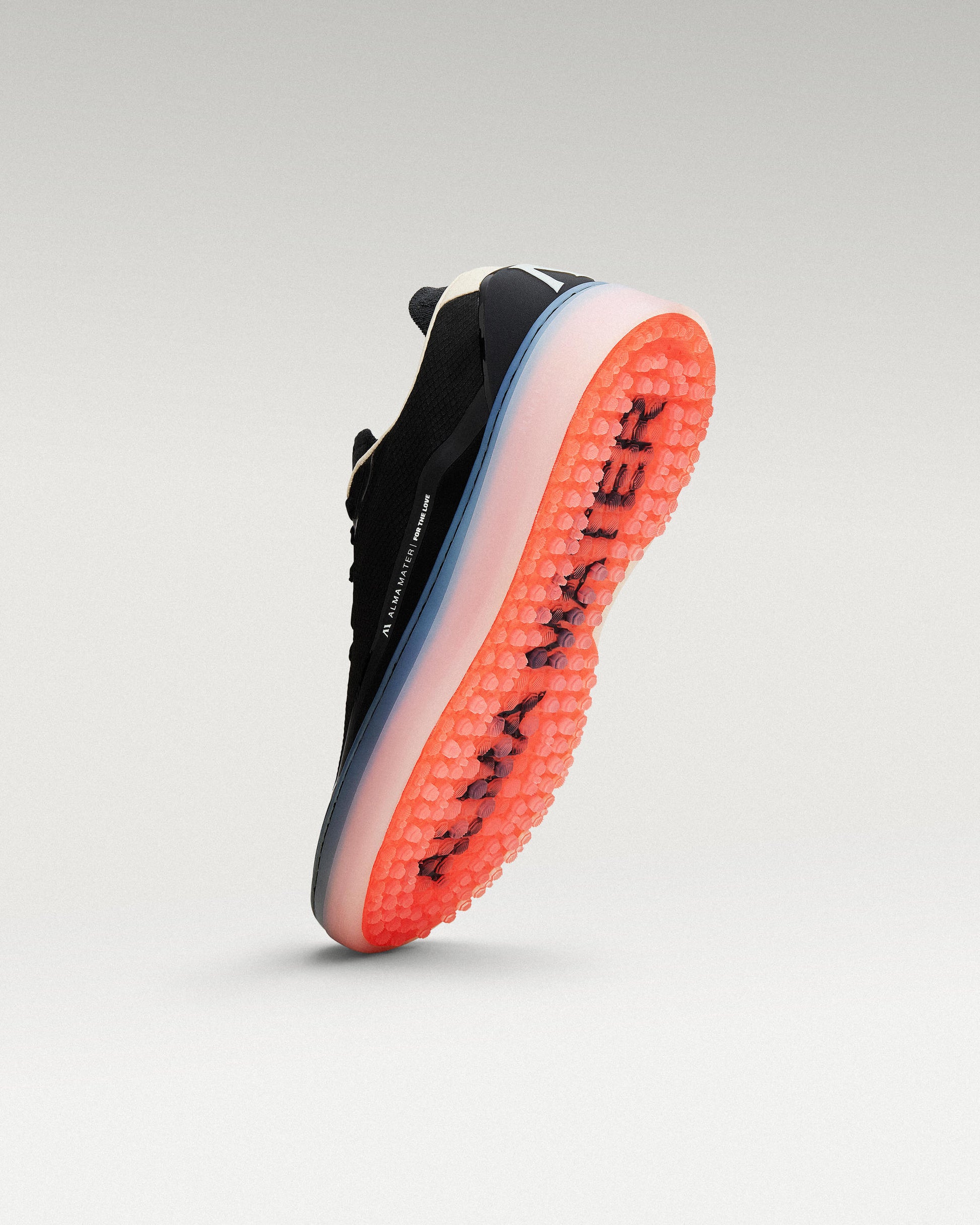 Angled view of black and flare Beta Lite golf shoe