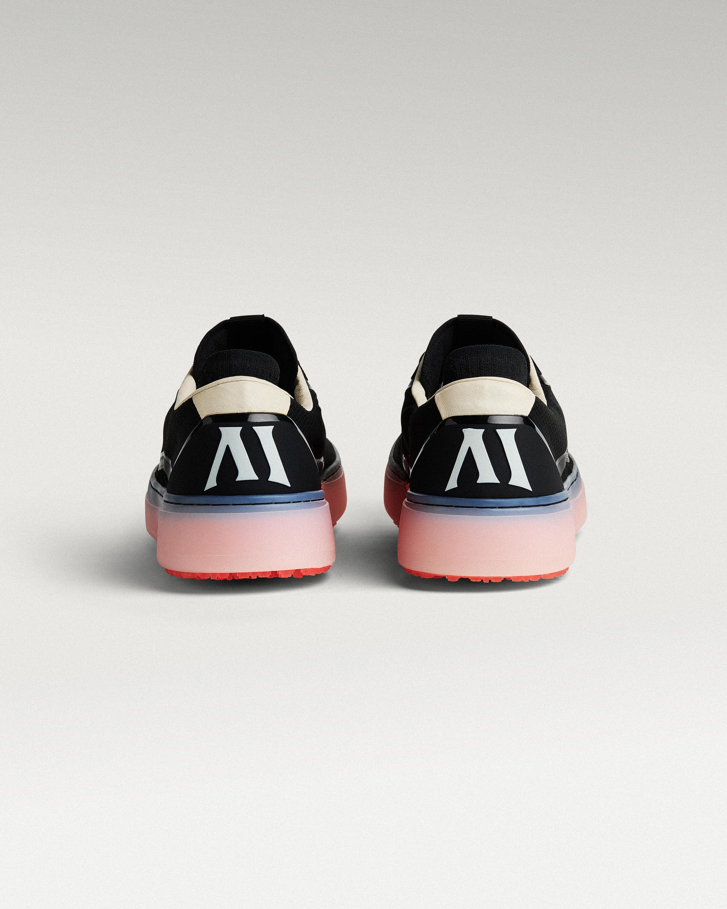 Back view of black and flare Beta Lite golf shoes with heel detail