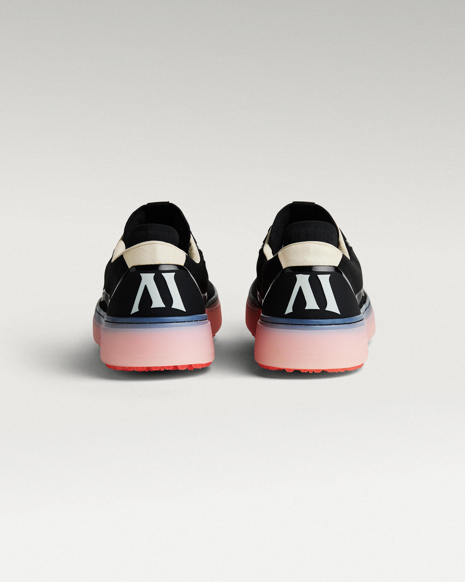 Back view of black and flare Beta Lite golf shoes with heel detail