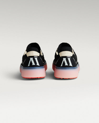 Back view of black and flare Beta Lite golf shoes with heel detail