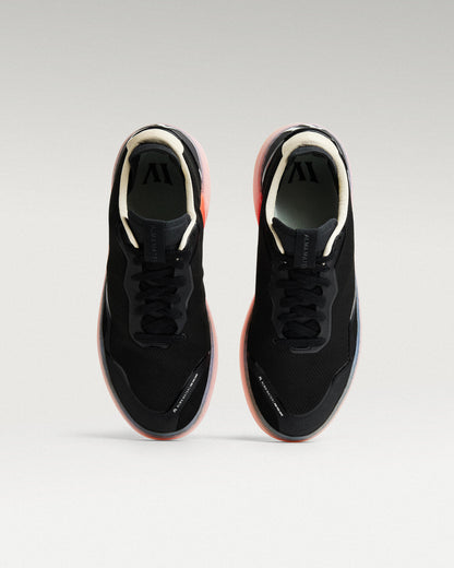 Top view of black and flare Beta Lite golf shoes