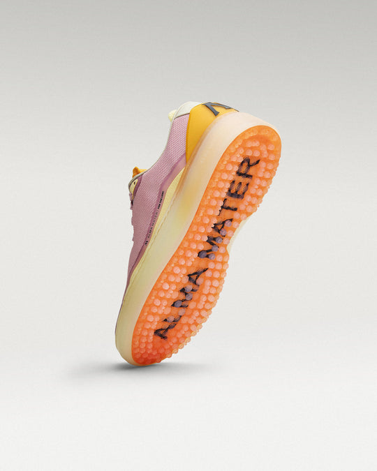 Bottom view of Lavender-Orange Beta Lite golf shoe showing traction pattern