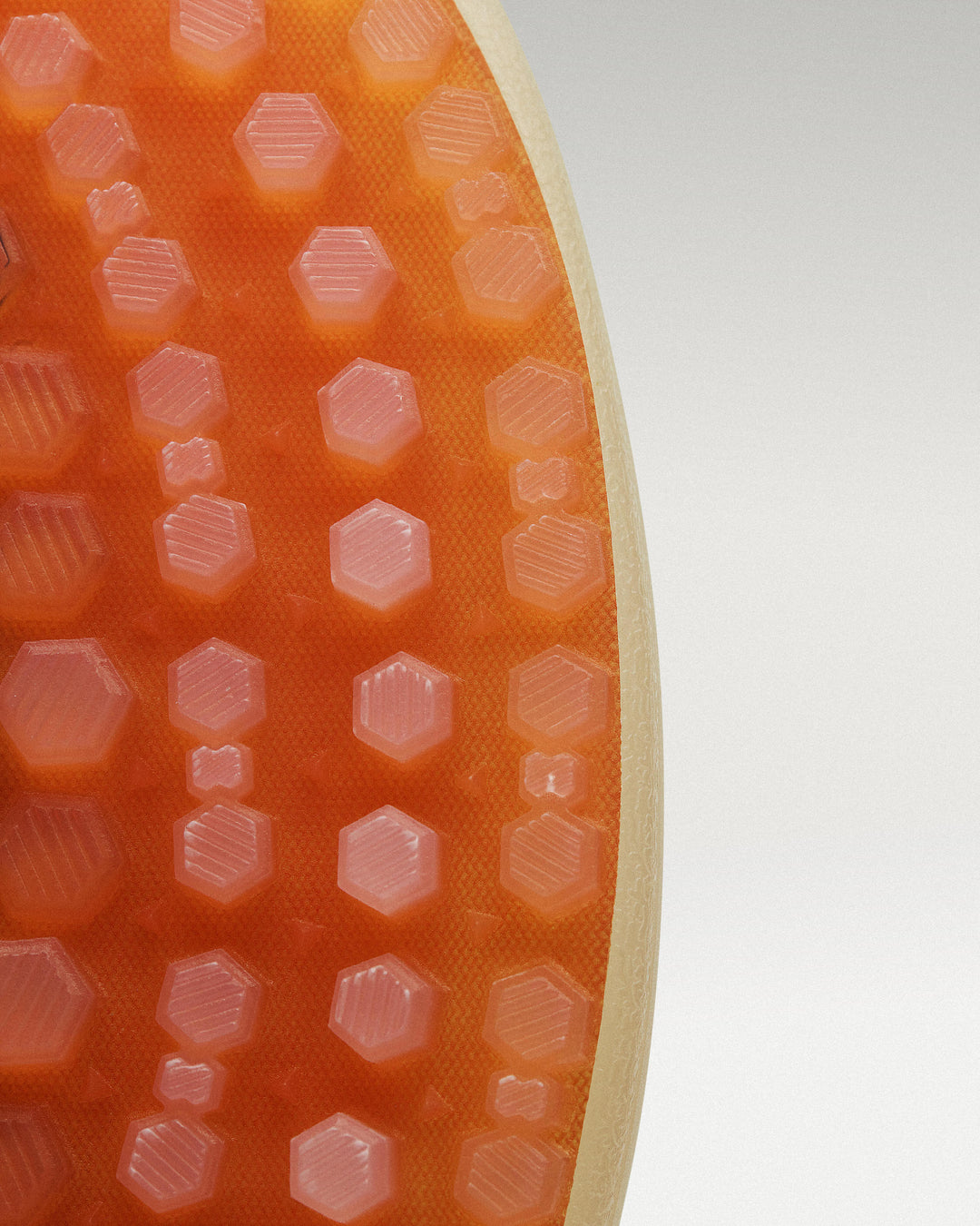 Outsole view of Lavender-Orange Beta Lite golf shoe showing traction pattern