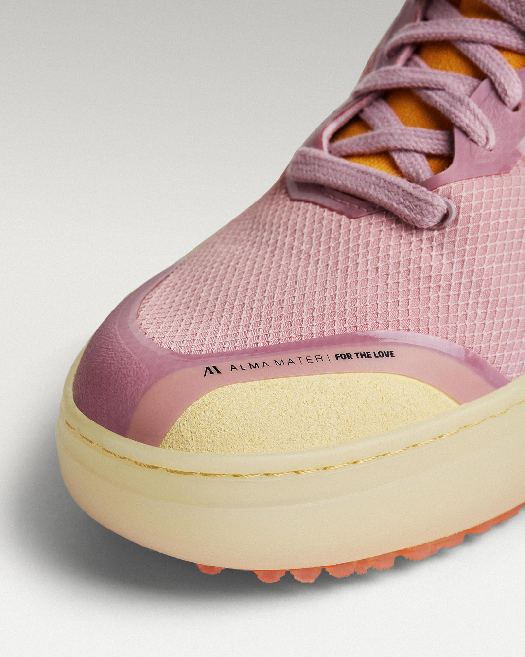 Close-up of Lavender-Orange mesh upper and toe box detail on Beta Lite golf shoe