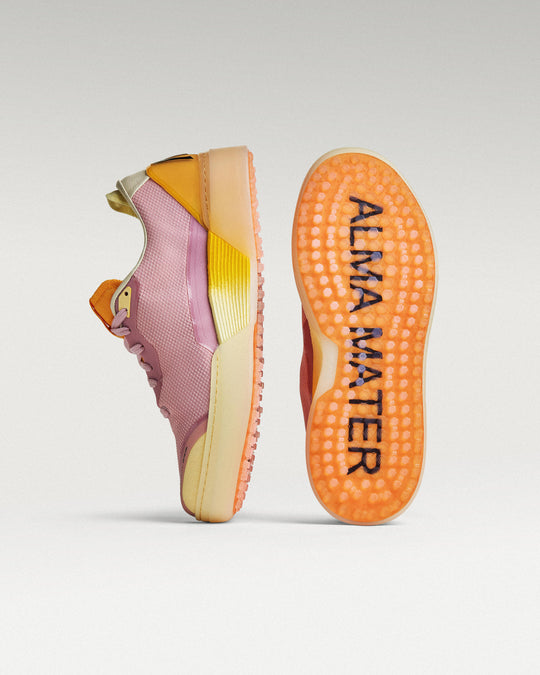 Lavender-Orange Beta Lite golf shoe with outsole facing forward, showing traction pattern and logo