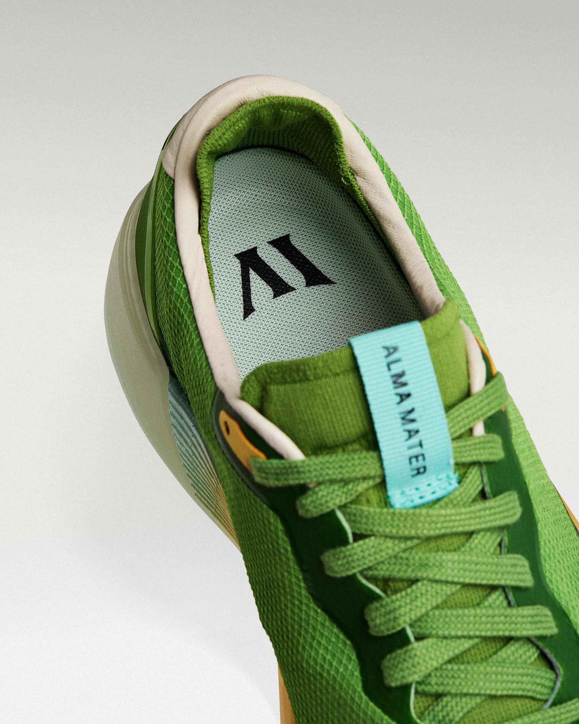 Close-up of interior lining and insole with logo, showcasing floating fit system