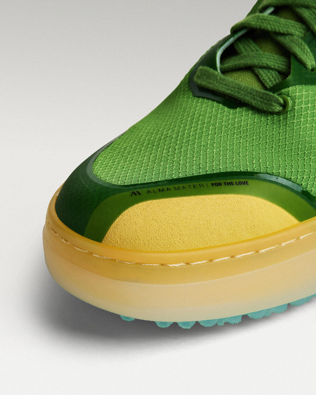Close-up of Olive/Aqua mesh upper and toe box detail on Beta Lite golf shoe