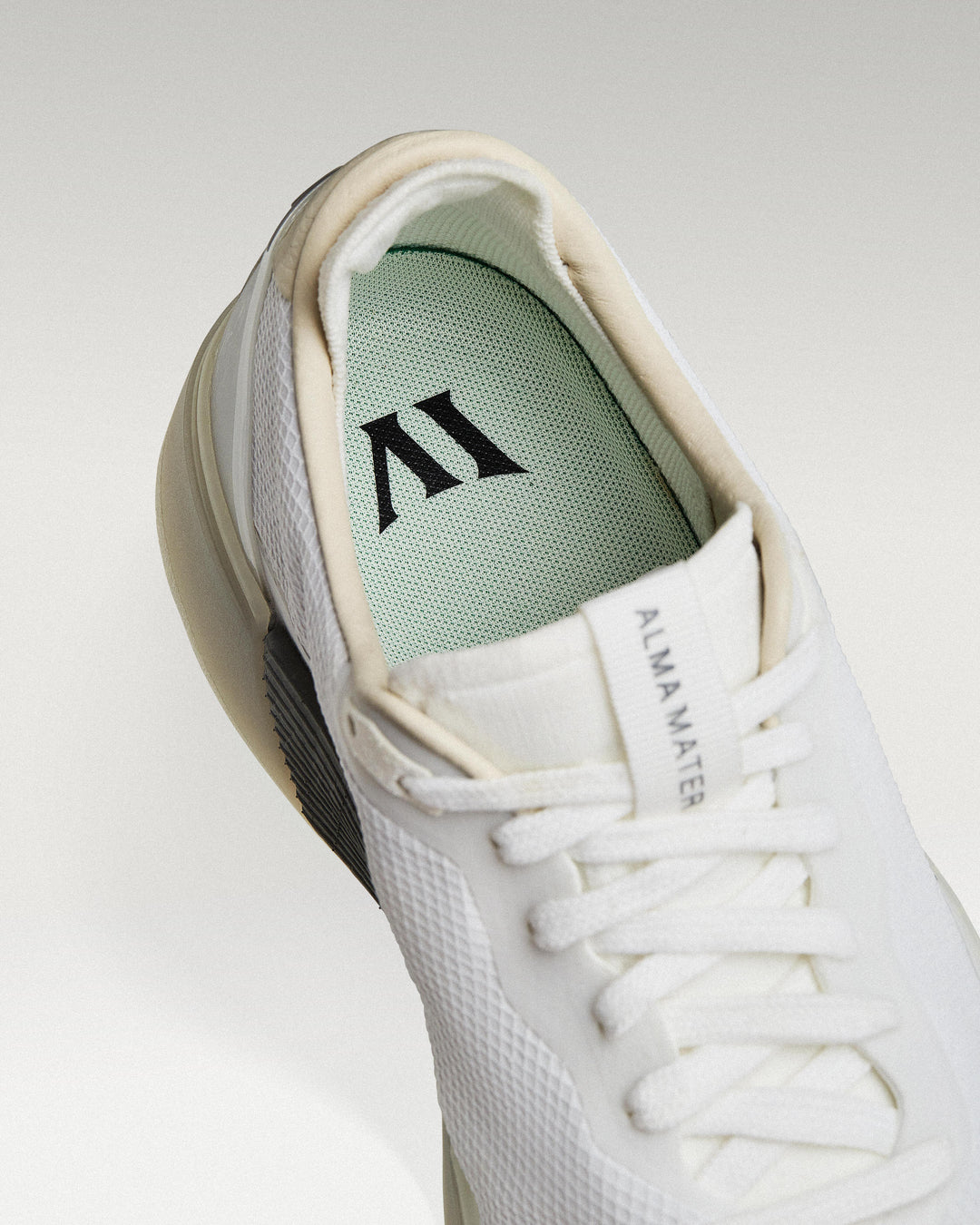 Close-up of interior lining and insole with logo, showcasing floating fit system