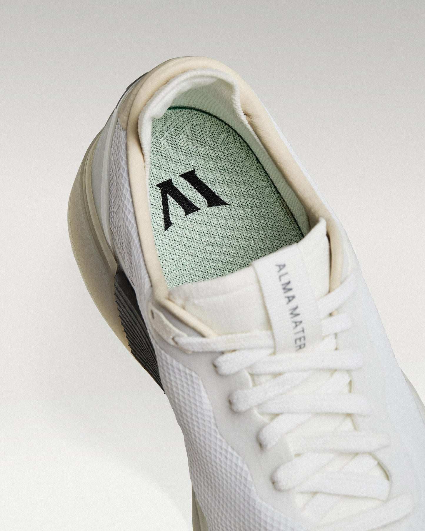 Close-up of interior lining and insole with logo, showcasing floating fit system