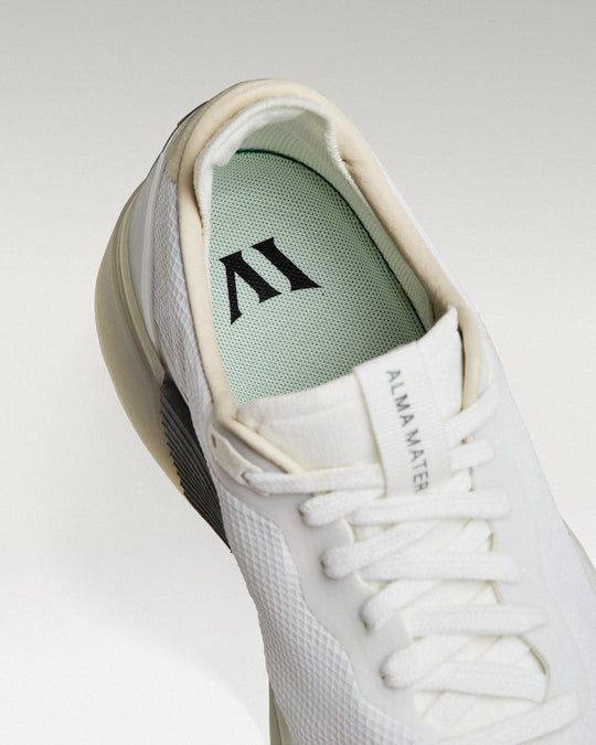 Close-up of interior lining and insole with logo, showcasing floating fit system