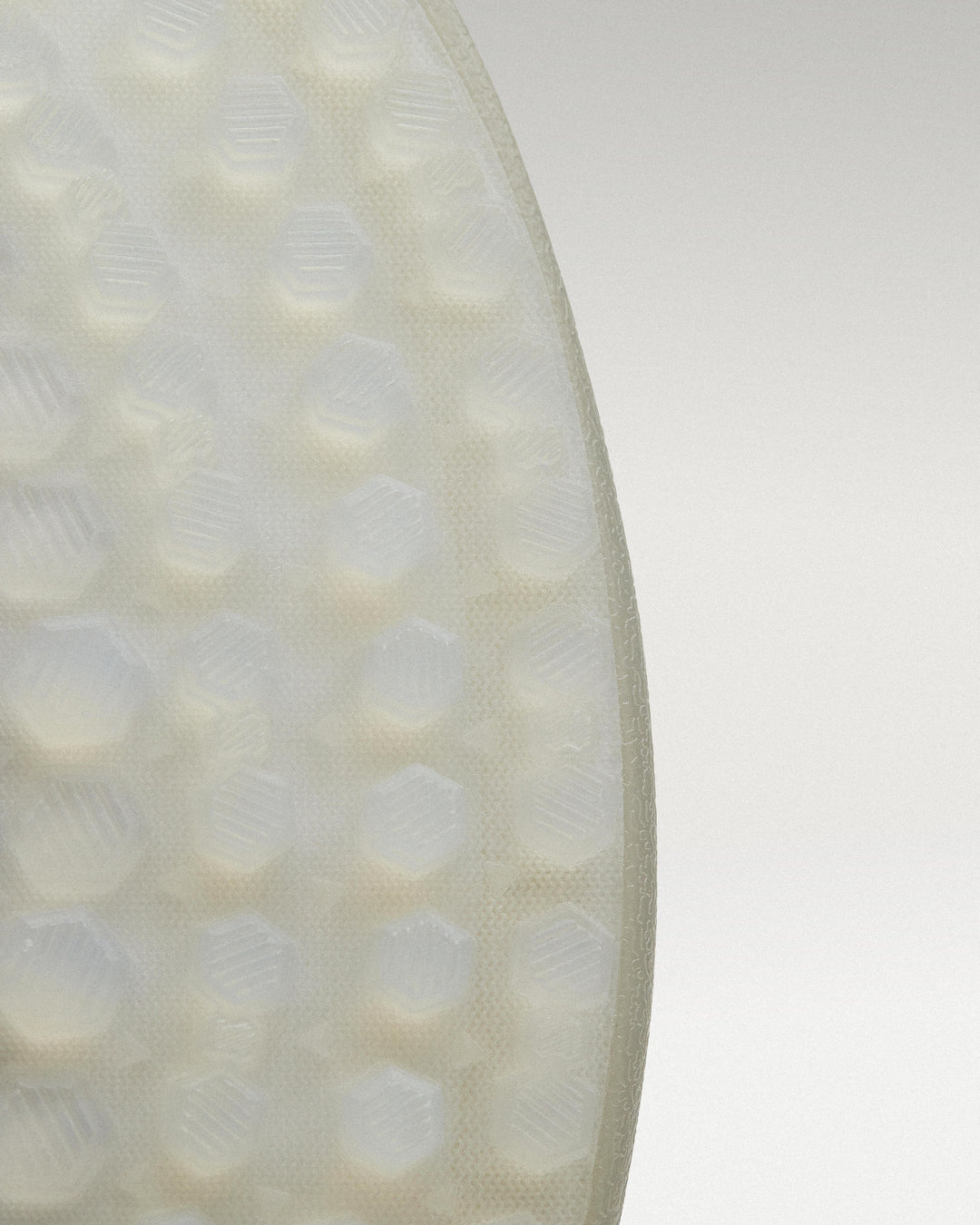 Outsole view of white and grey Beta Lite golf shoe showing traction pattern