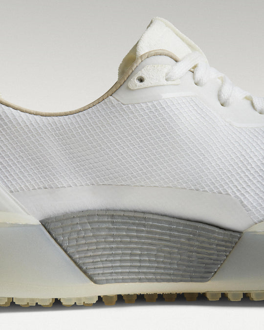 Close-up of side panel showing slipper construction, textured mesh and support structure