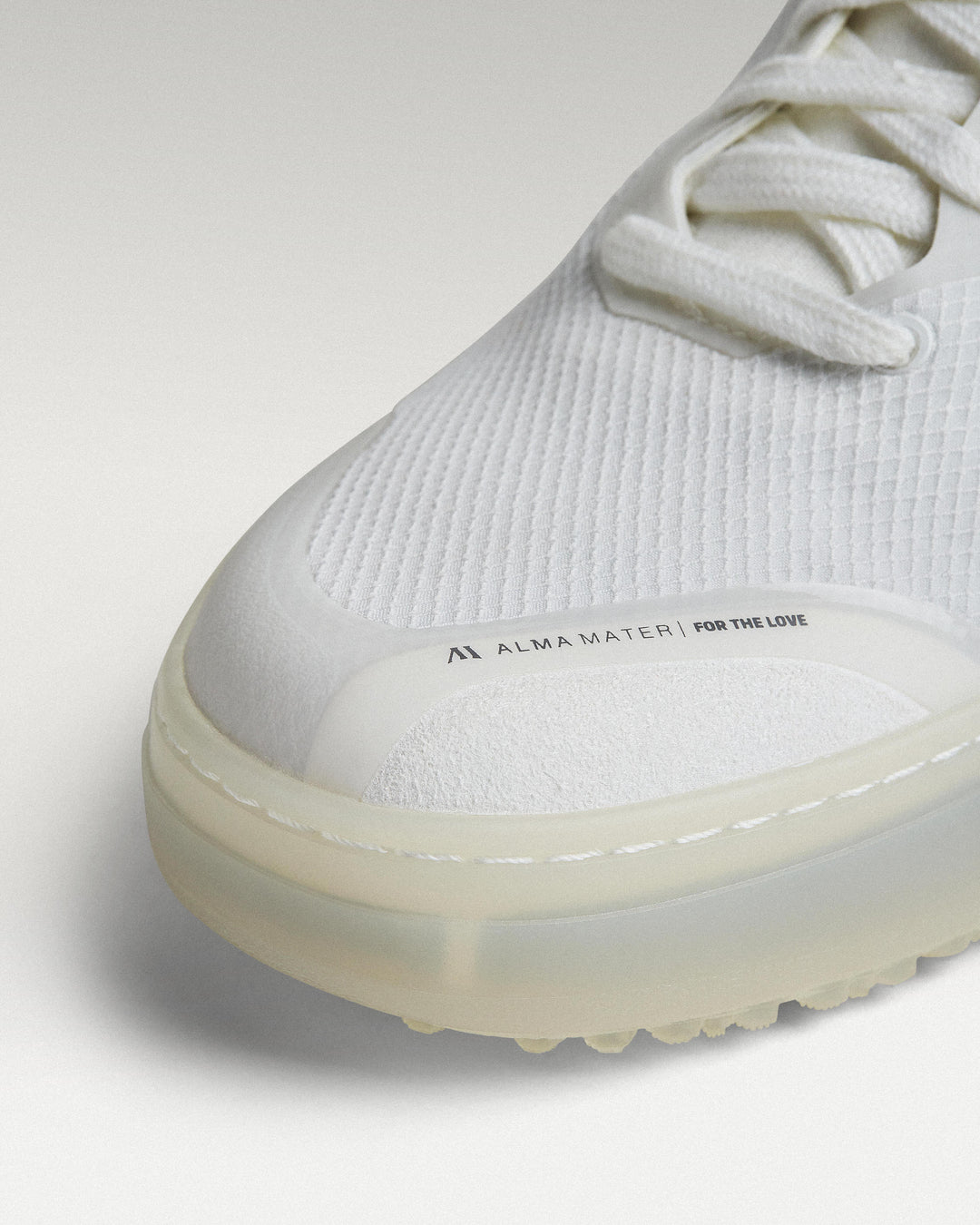 Close-up of white mesh upper and toe box detail on Beta Lite golf shoe