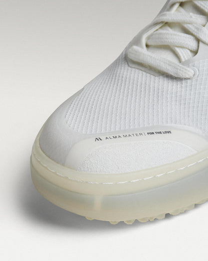 Close-up of white mesh upper and toe box detail on Beta Lite golf shoe