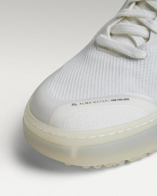 Close-up of white mesh upper and toe box detail on Beta Lite golf shoe