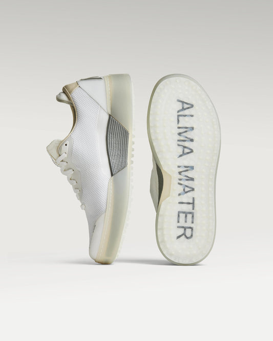 White and grey Beta Lite golf shoe with outsole facing forward, showing traction pattern and logo
