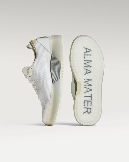 White and grey Beta Lite golf shoe with outsole facing forward, showing traction pattern and logo