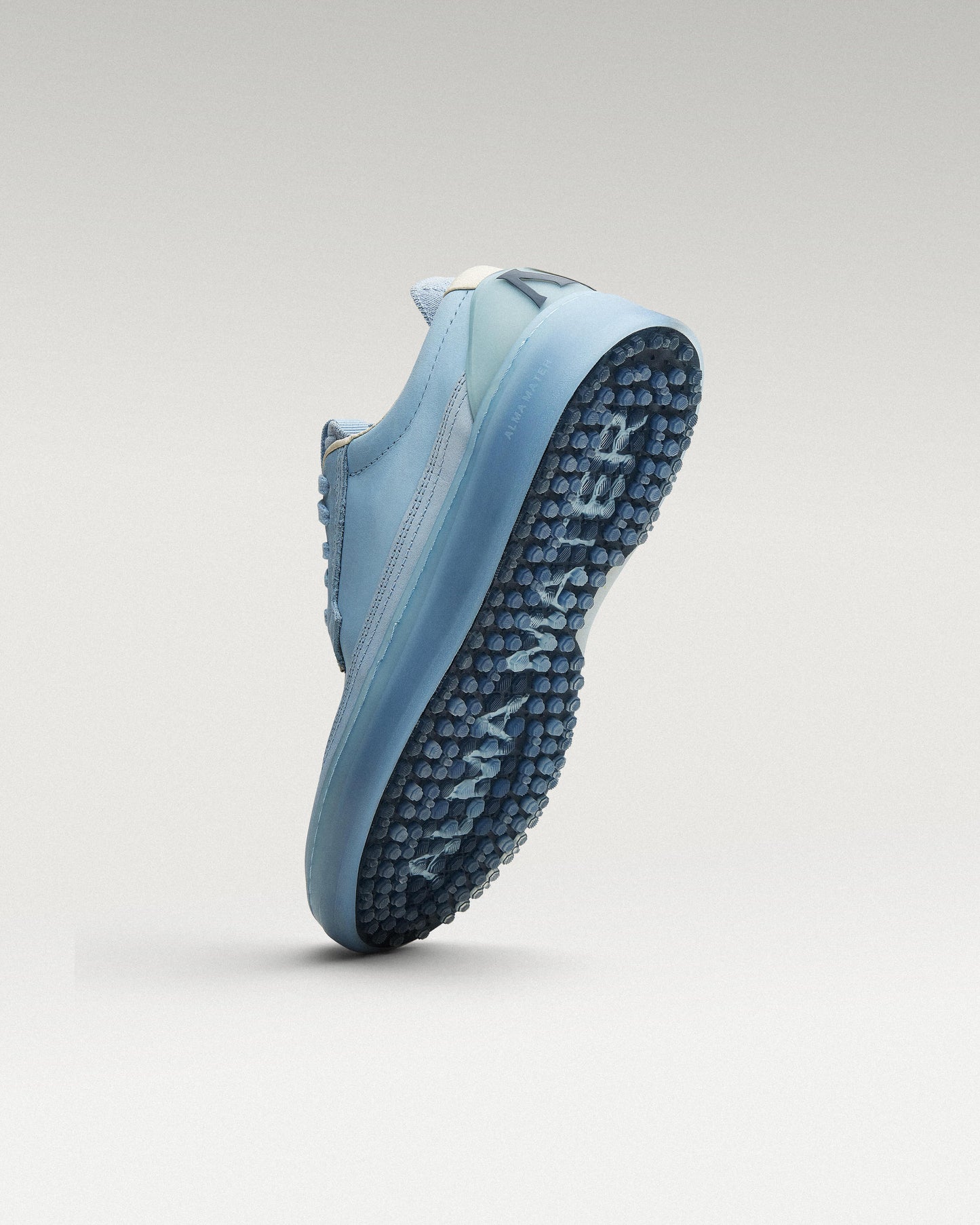 Bottom view of Sky/Navy Beta Longwing golf shoe showing traction pattern
