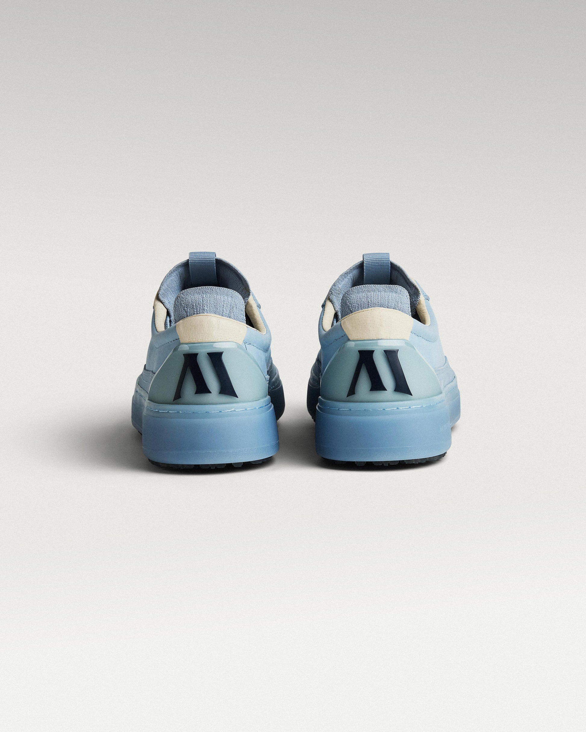 Back view of Sky/Navy Beta Longwing golf shoes with heel detail