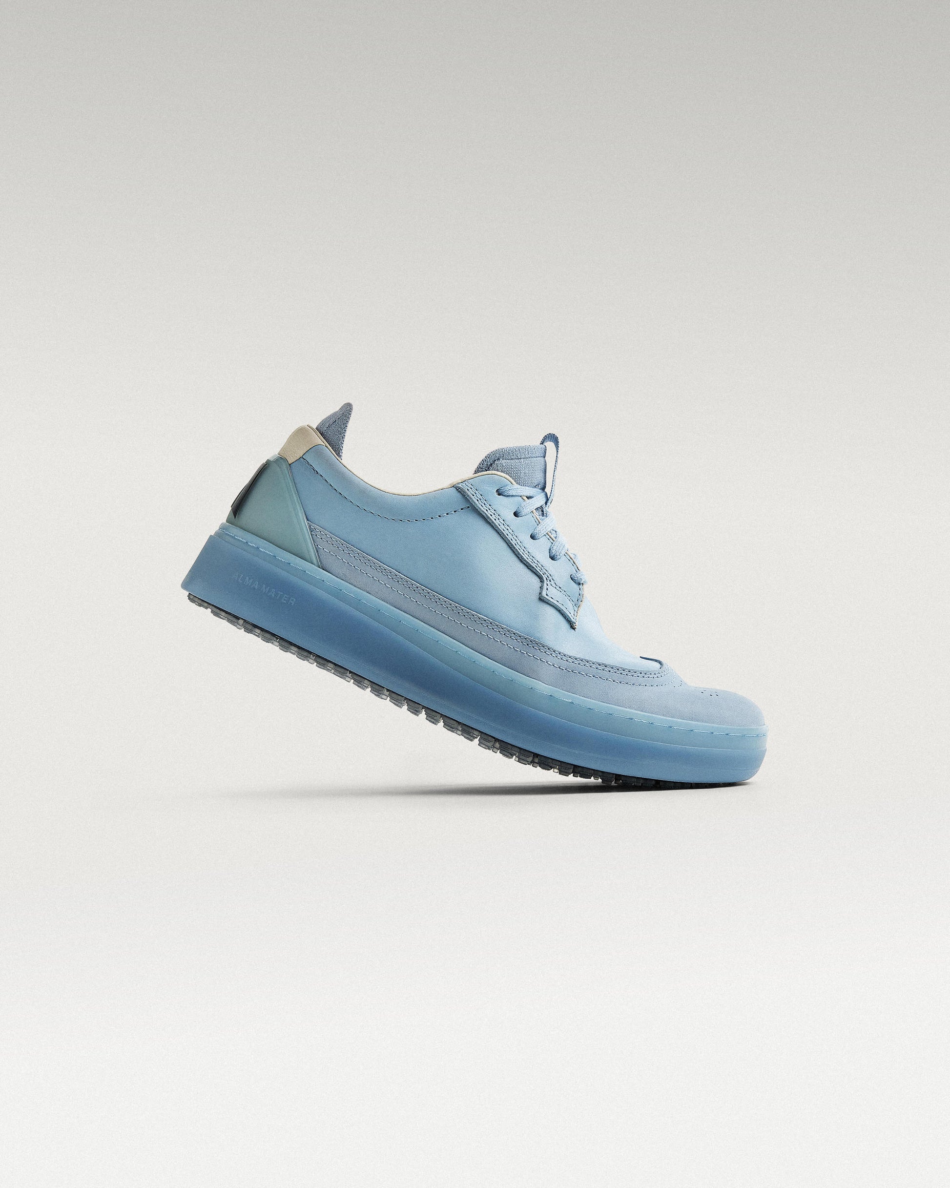Side view of Sky/Navy Beta Longwing golf shoe, showcasing flex