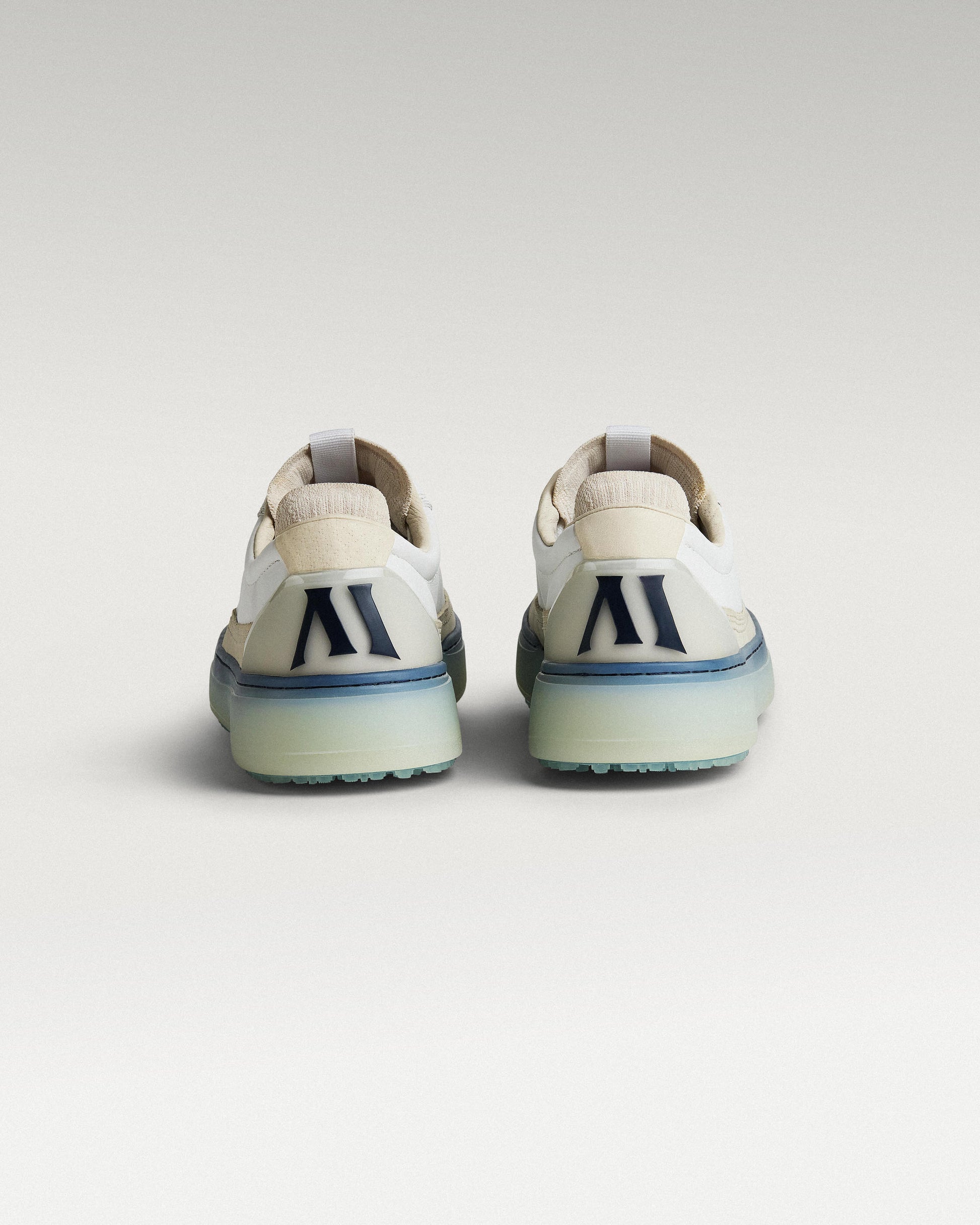 Back view of white/navy Beta Longwing golf shoes with heel detail