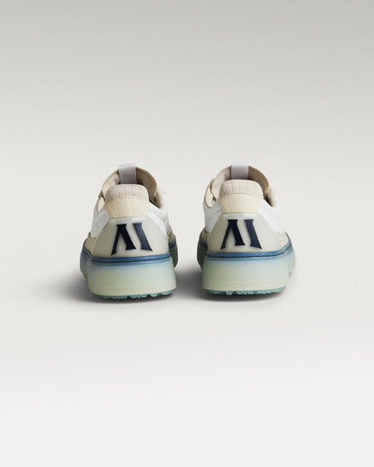 Back view of white/navy Beta Longwing golf shoes with heel detail