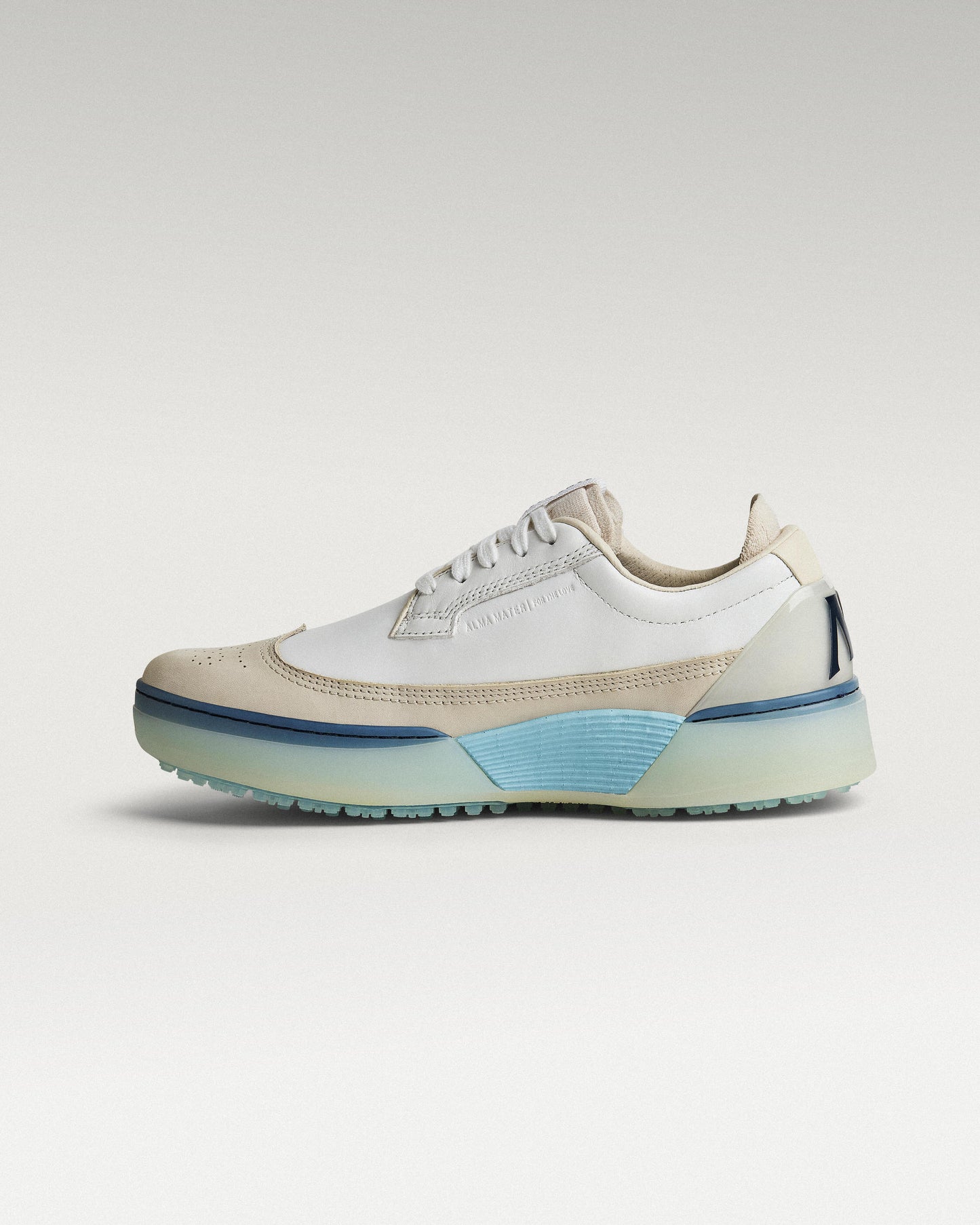 Medial view of white/navy Beta Longwing golf shoe