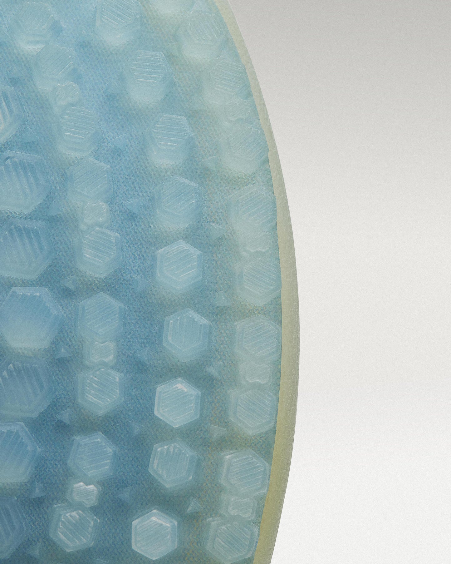 Outsole view of White/Navy Beta Longwing golf shoe showing traction pattern