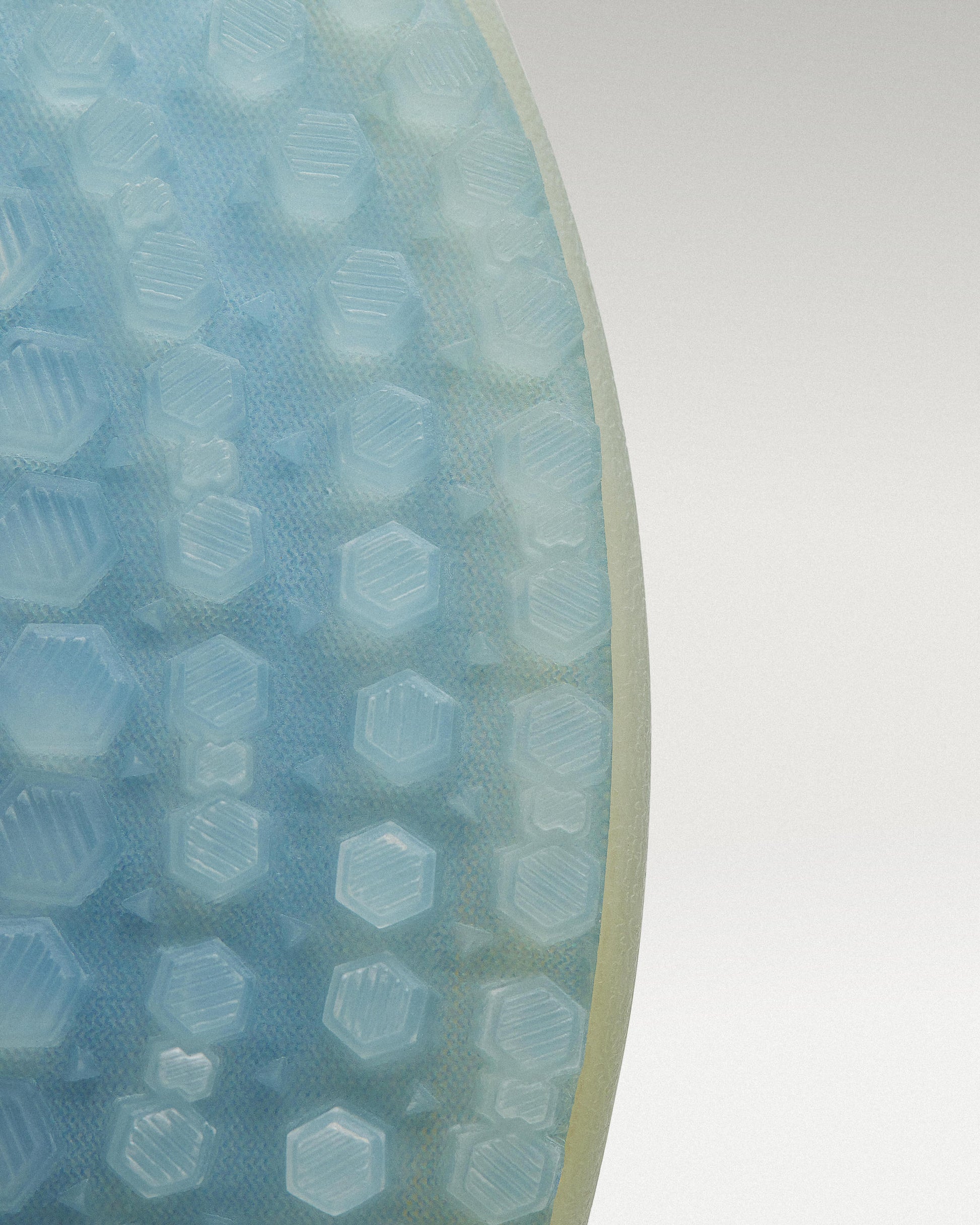 Outsole view of White/Navy Beta Longwing golf shoe showing traction pattern