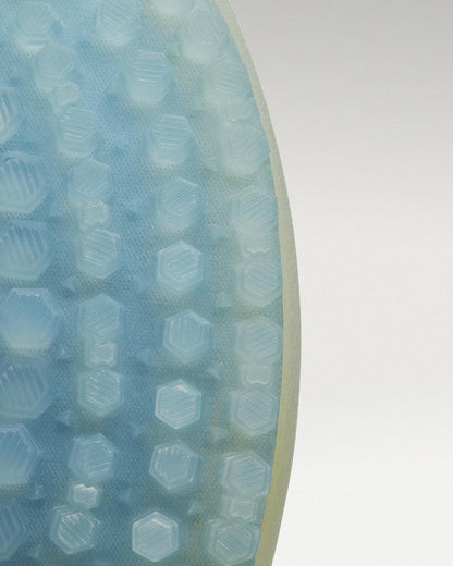 Outsole view of White/Navy Beta Longwing golf shoe showing traction pattern