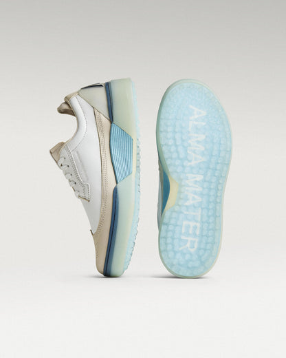 White/Navy Beta Longwing golf shoe with outsole facing forward, showing traction pattern and logo