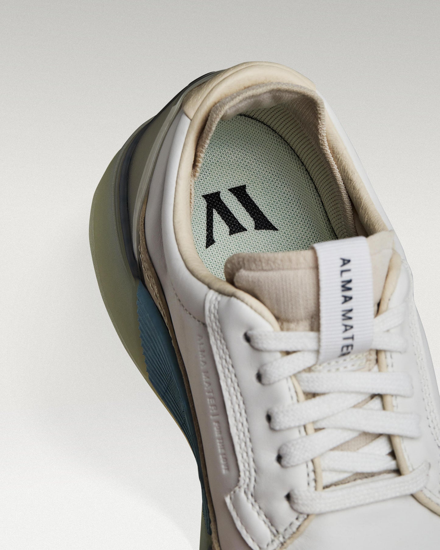 Close-up of interior lining and insole with logo, showcasing floating fit system