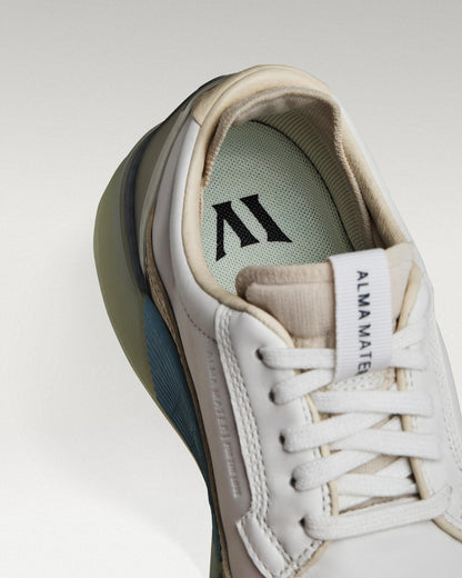 Close-up of interior lining and insole with logo, showcasing floating fit system