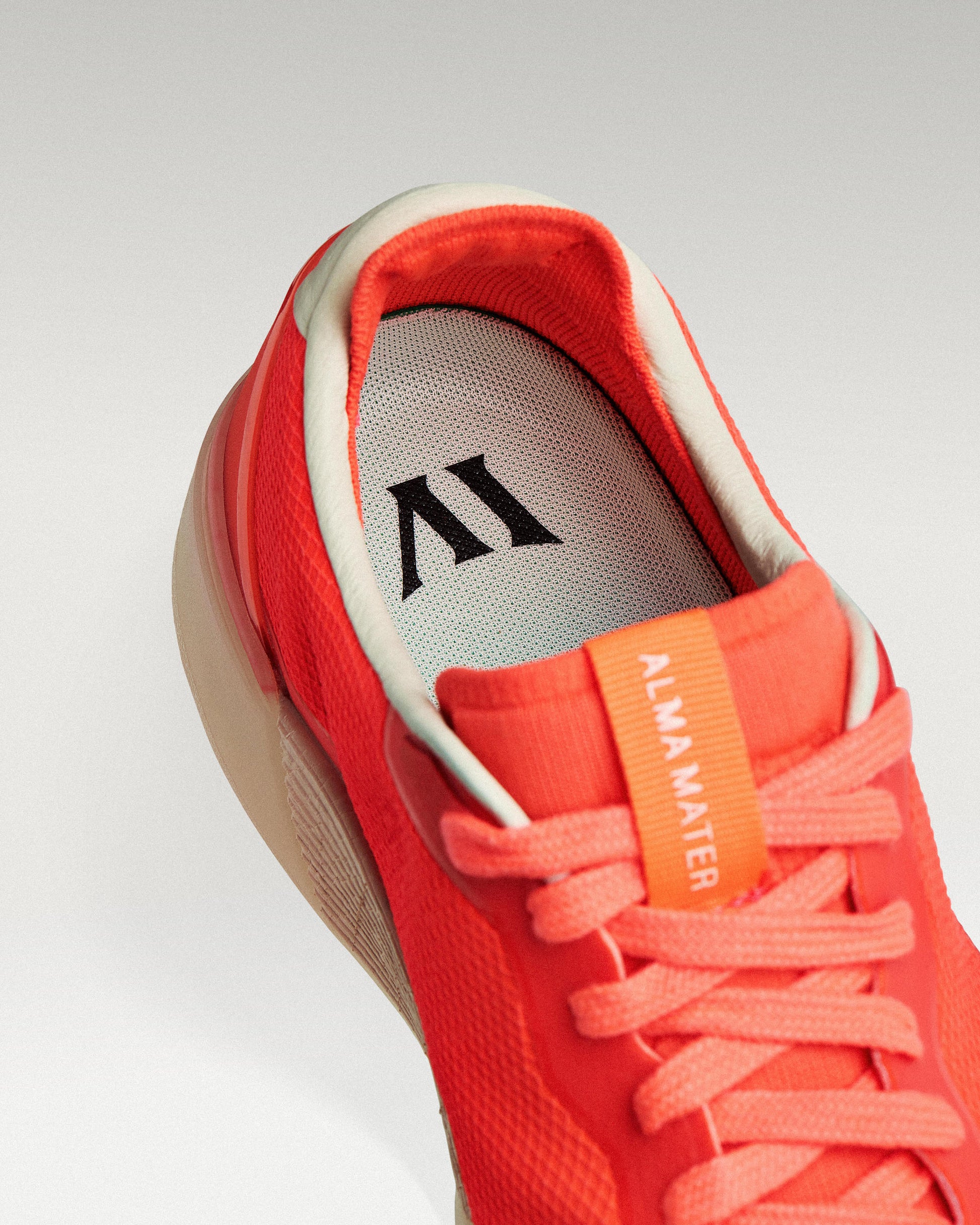 Close-up of interior lining and insole with logo, showcasing floating fit system