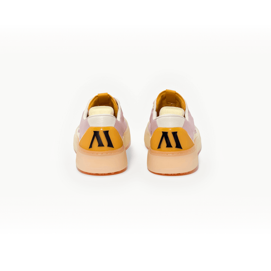 Rear studio view of the Men’s Beta Lite in Lavender and Orange, shown as a pair with orange heel detail, Alma Mater logo at the heel