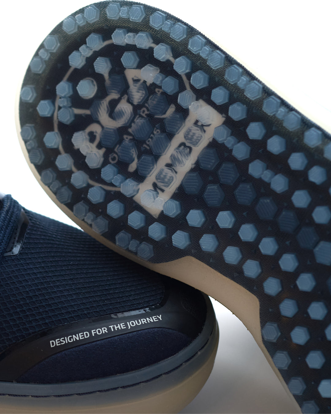 Close-up of Member LIte PGA outsole with 'PGA' branding and text on a white background