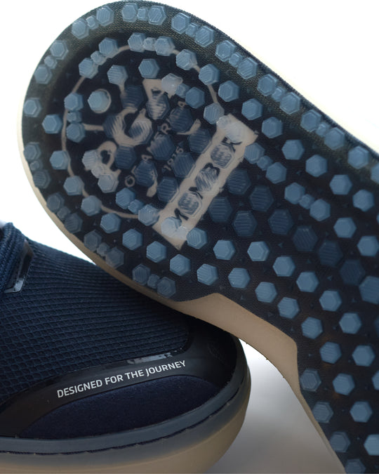 Close-up of Member LIte PGA outsole with 'PGA' branding and text on a white background