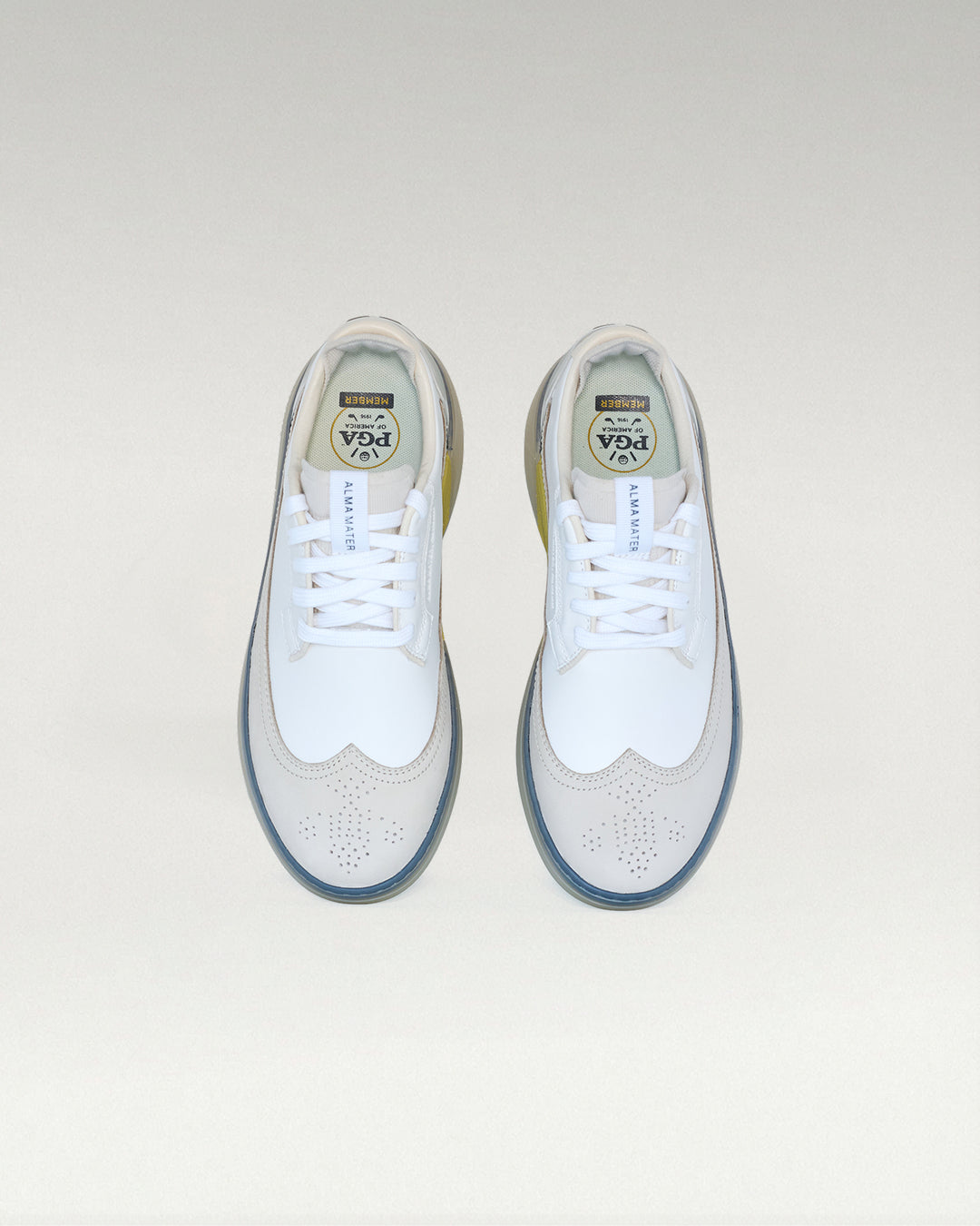 Overhead view of white and navy Member Longwing PGA sneakers