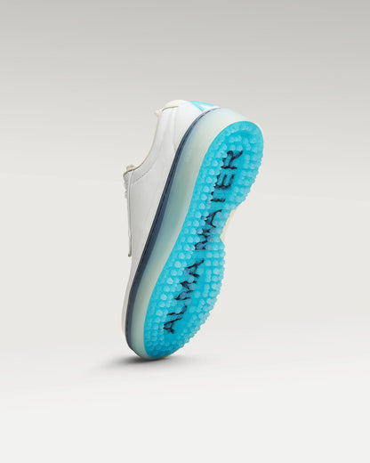 Bottom view of white and aqua Beta Derby golf shoe showing traction pattern