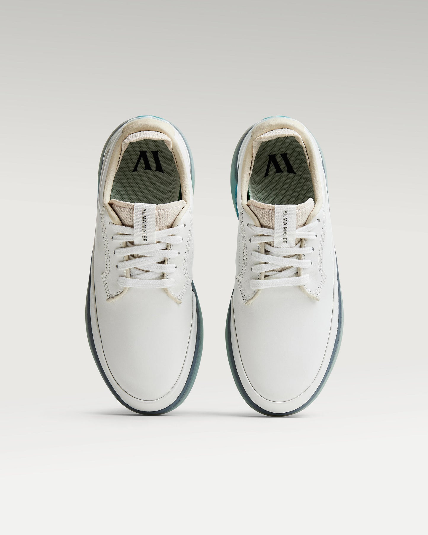 Top view of white and aqua Beta Derby golf shoes