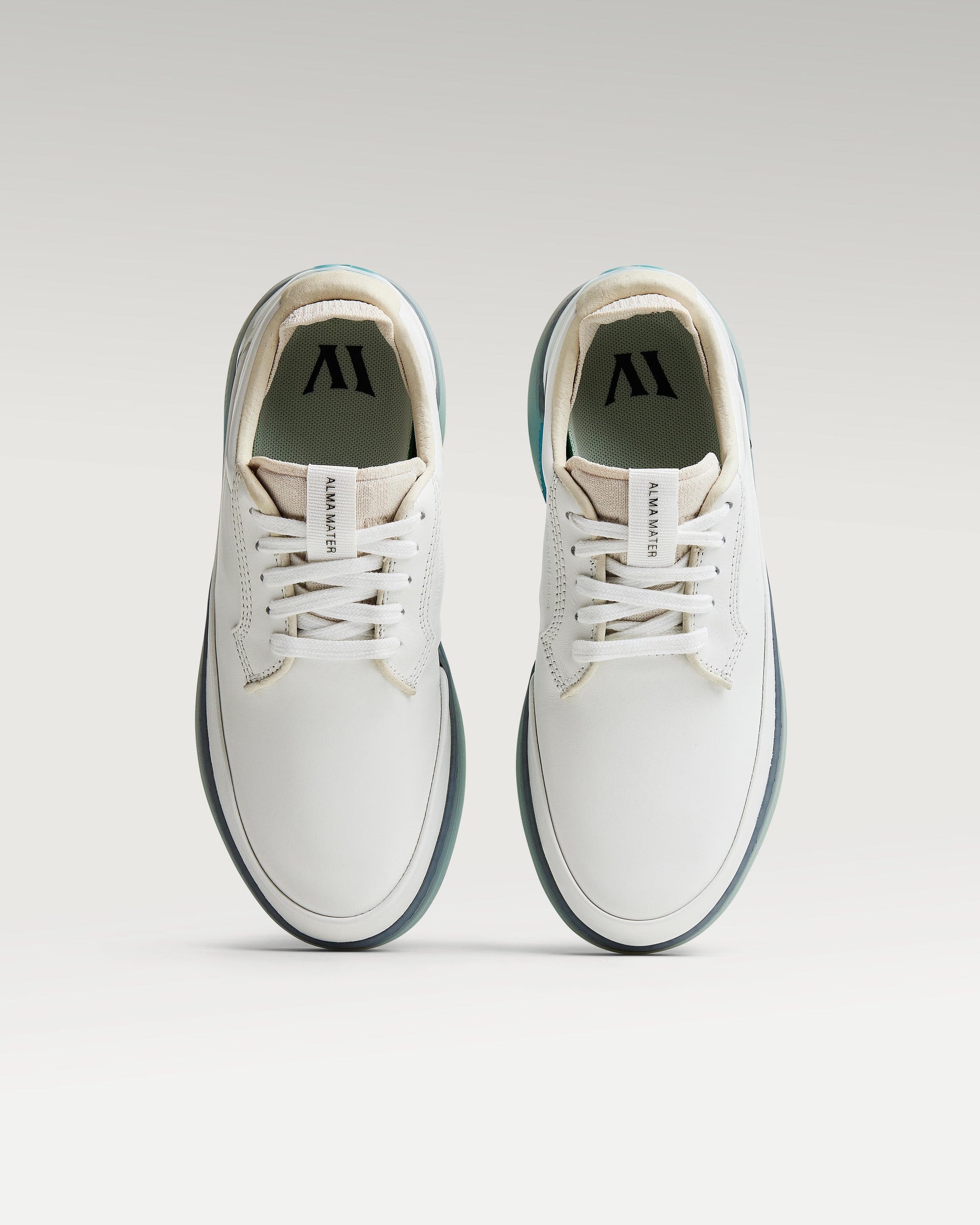 Top view of white and aqua Beta Derby golf shoes