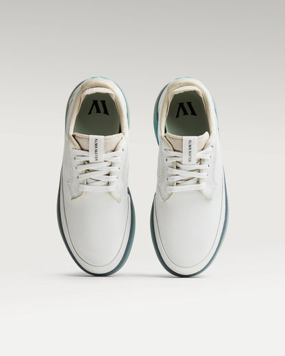 Top view of white and aqua Beta Derby golf shoes