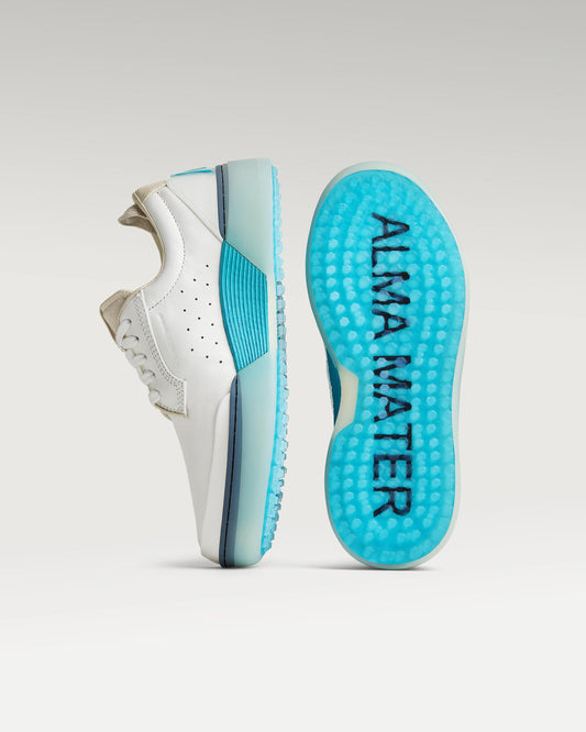 White and Aqua Beta Derby golf shoe with outsole facing forward, showing traction pattern and logo