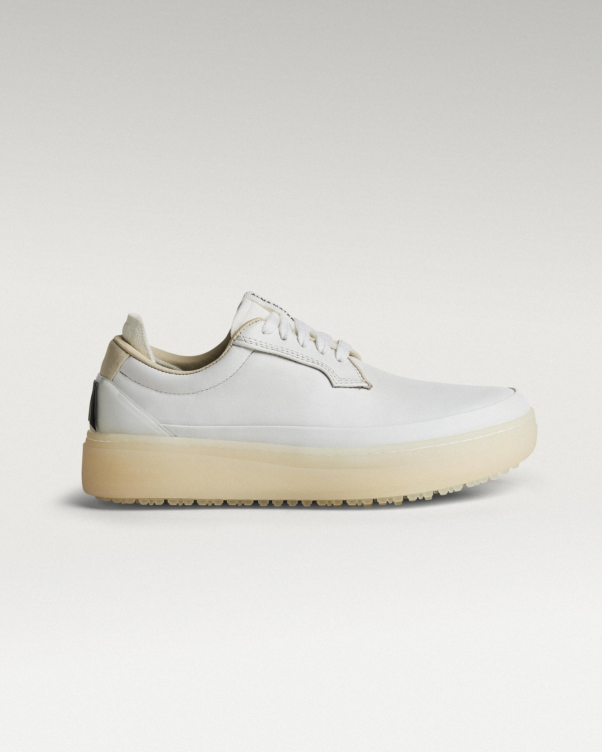 Lateral view of white and white Beta Derby golf shoe