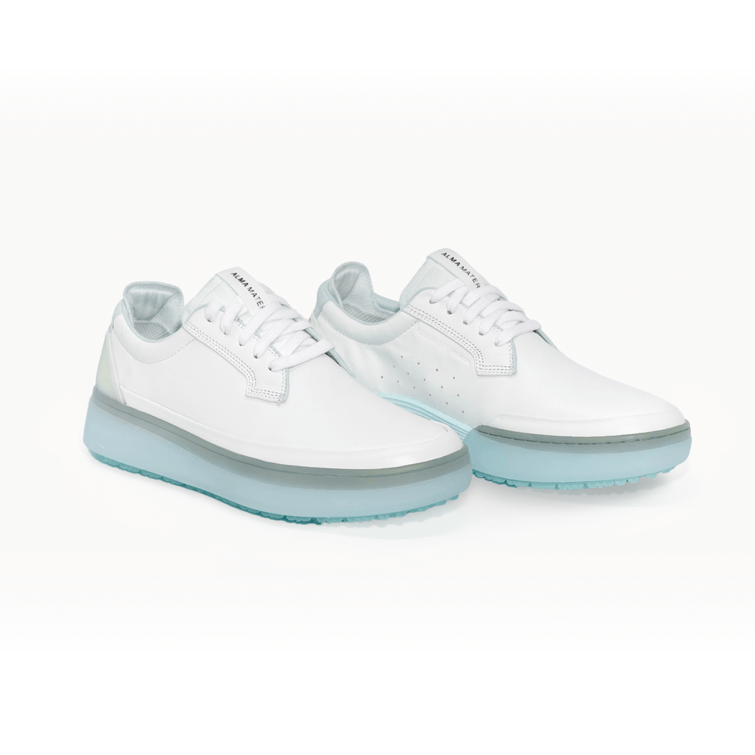 Studio image of the Women’s Beta Derby in White and Aqua, shown as a pair with smooth premium leather upper, lace-up closure, subtle perforation detailing, and translucent aqua Gripper