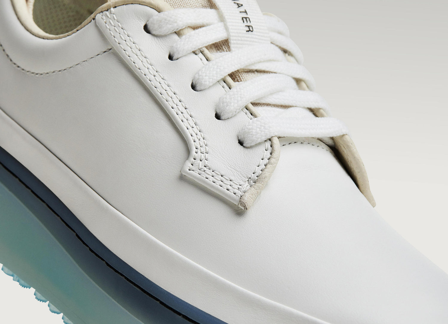 White Beta Derby sneaker featuring smooth leather upper, stitching detail, and lace-up closure