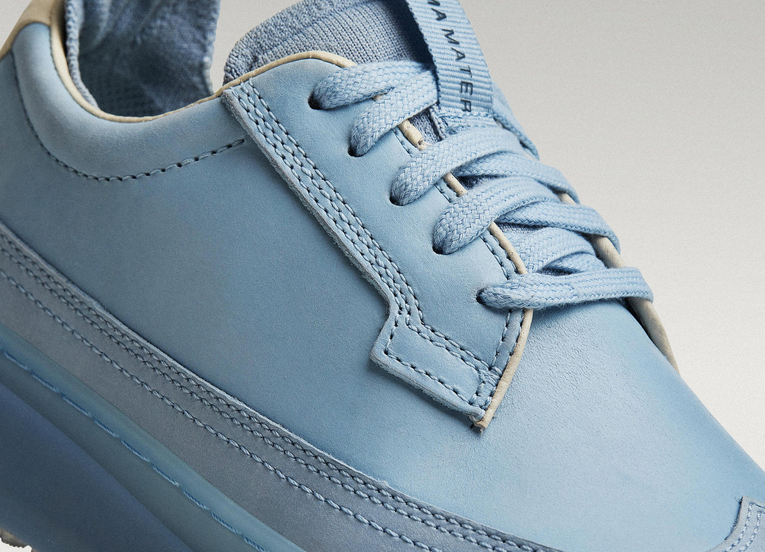 Sky/Navy Beta Longwing sneaker featuring smooth leather upper, stitching detail, and lace-up closure